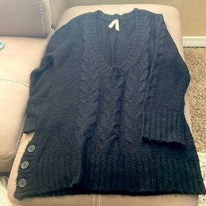 Beautiful, long black sweater with scoopneck accent buttons on the right side